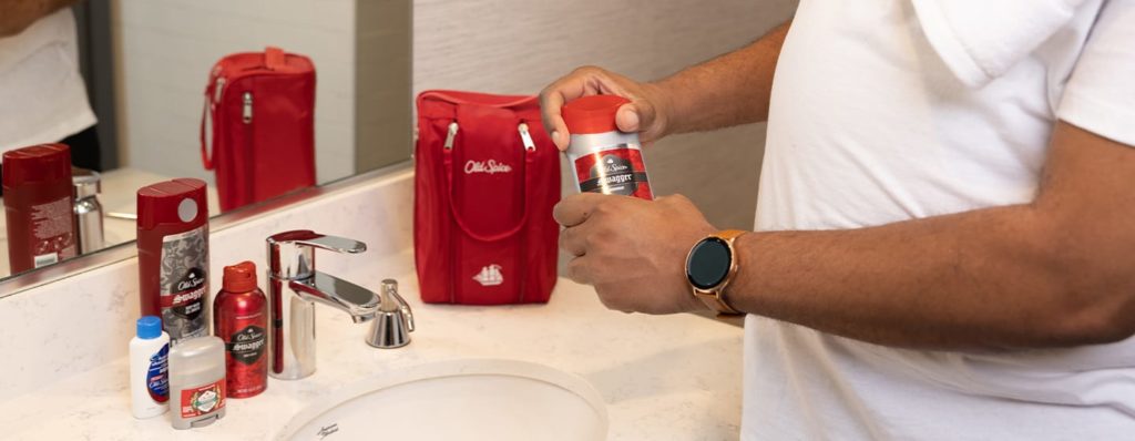 Man opening Old Spice gift bag